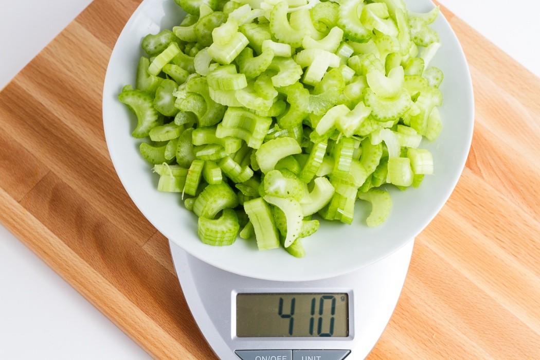 410 grams of chopped celery on a scale