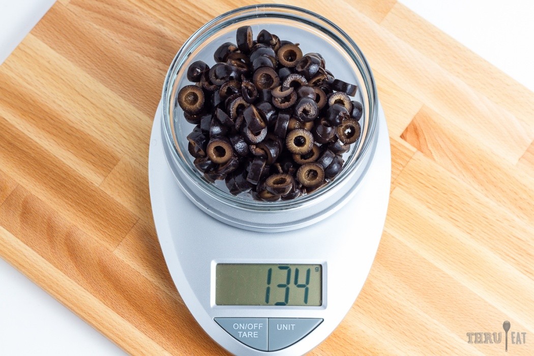 Do not rinse the olives, just drain them thoroughly 134 grams sliced black olives on a scale