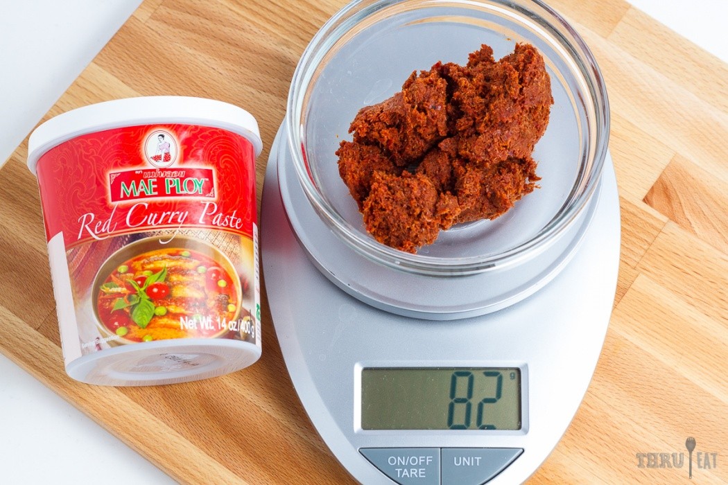 Curry paste isn't very appetizing looking 82 grams of red curry paste on a scale