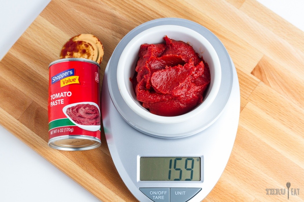 Tomato paste can add a punch of flavor to many dishes 159 grams of tomato paste on a scale