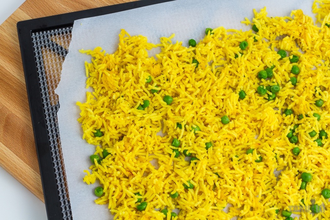 golden basmati rice on a dehydrator tray