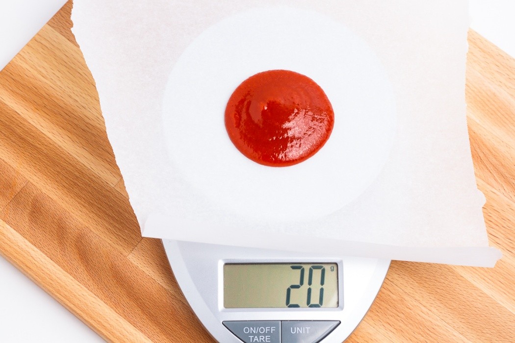 Use parchment paper or ParaFlexx sheets when dehydrating Sriracha 20 grams of Sriracha on a scale