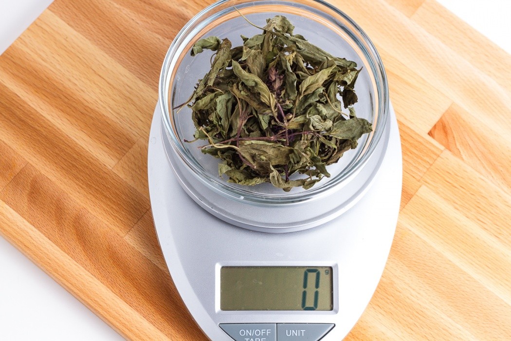 Dehydrated basil is so light that it doesn't even register on the scale in small amounts 1 grams of dehydrated thai basil