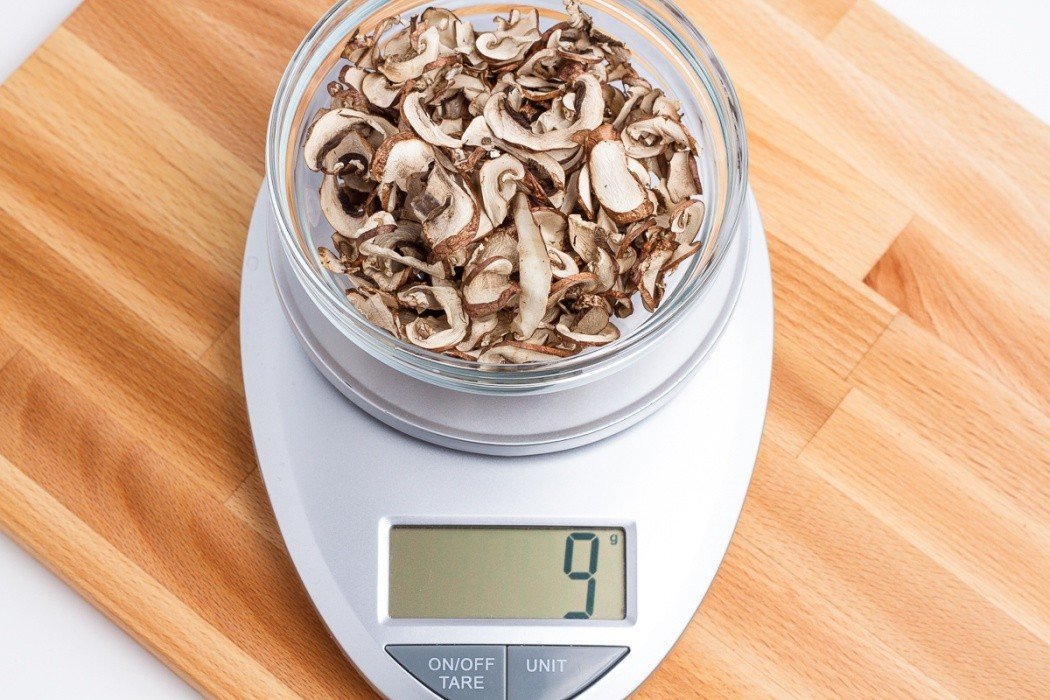 A significant weight savings is achieved by dehydrating mushrooms 9 grams of dried baby bella mushrooms on a scale