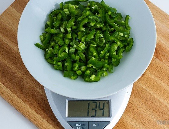 134 grams chopped jalapenos on a scale