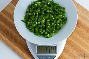 134 grams chopped jalapenos on a scale