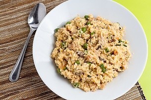 plated cheesy chicken couscous with mushrooms, peas, and carrots