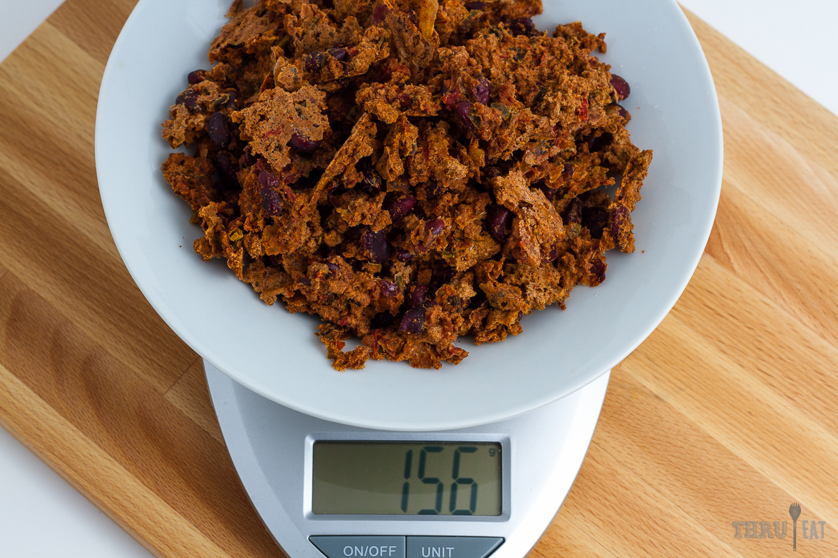 156 grams of dehydrated turkey chili on a scale